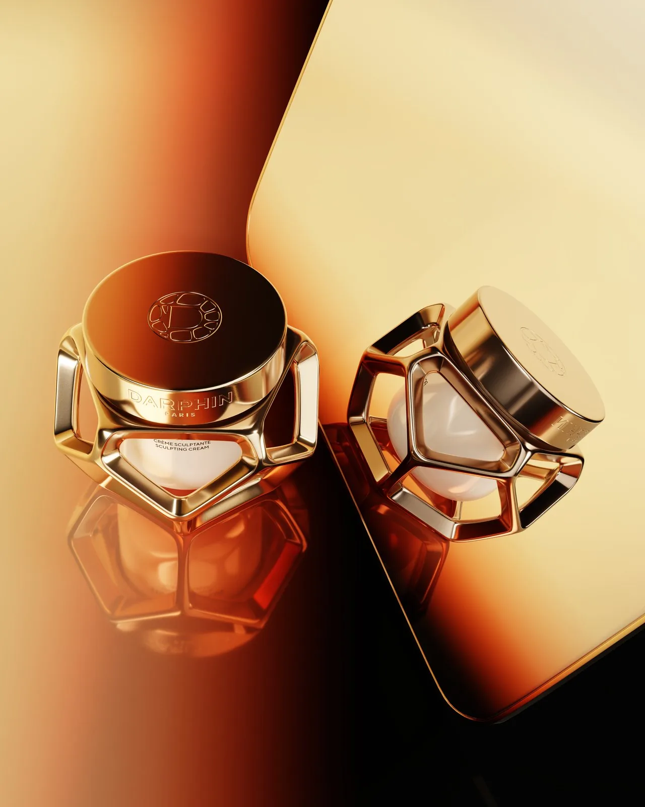 Darphin Stimulskin Plus — gold jars on mirrored surface, angle 2