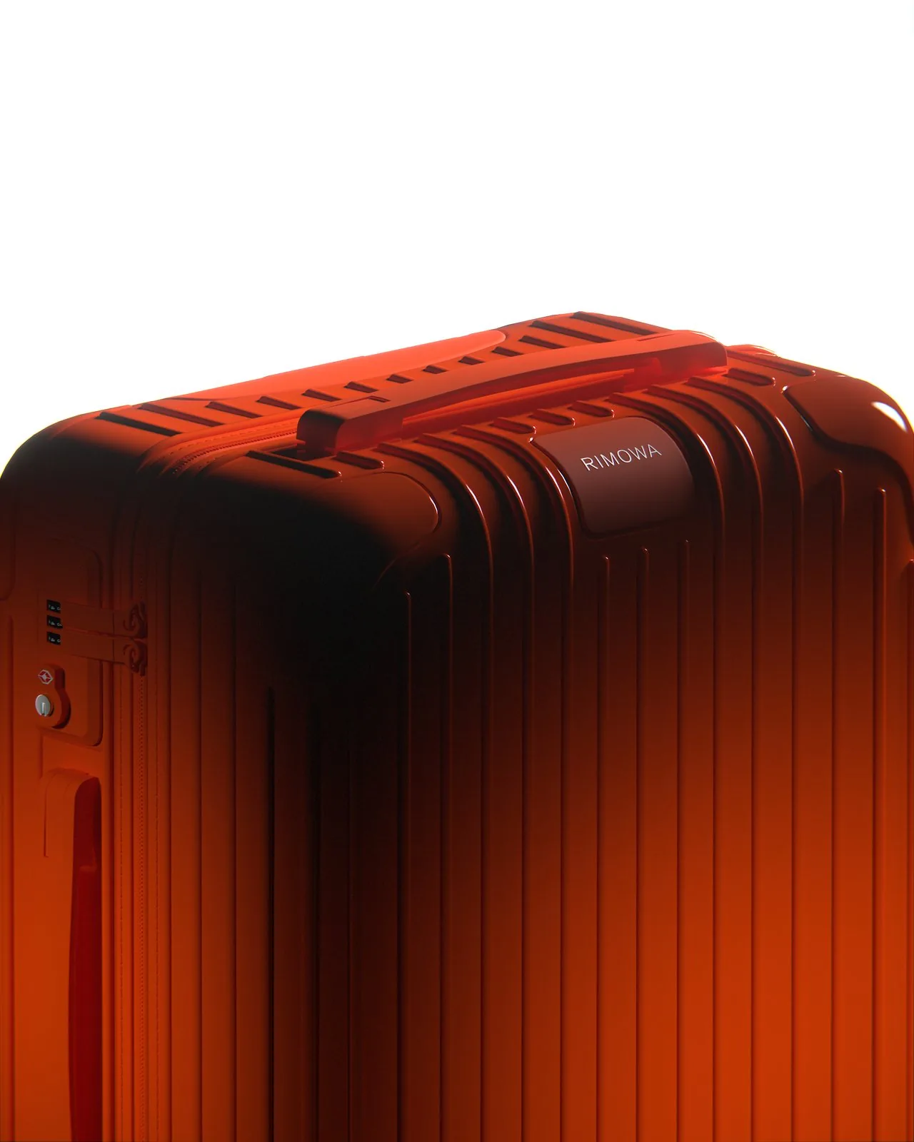 Rimowa — suitcase render in warm amber lighting, close angle